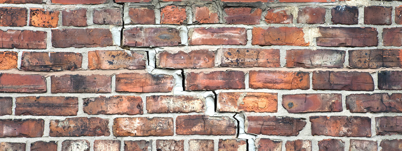 cracking brick walls
