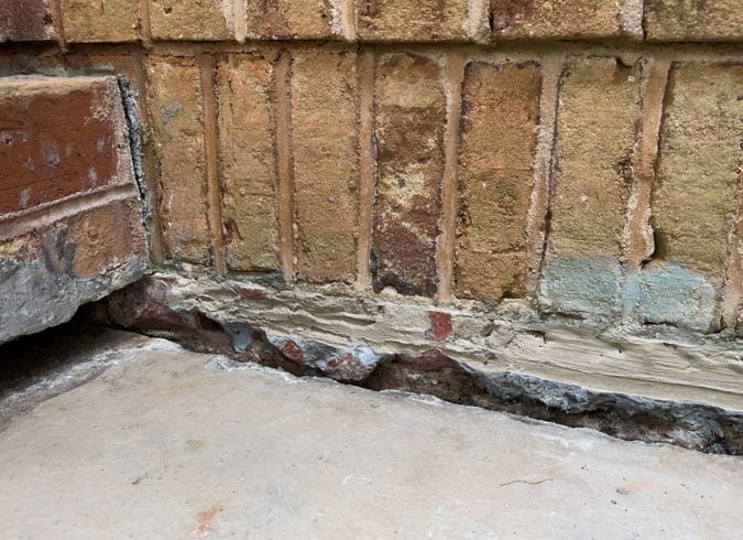 a concrete floor that has sunken down and needs poly-lifting to be repaired