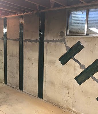 carbon fiber reinforcement done by ram jack to help correct bowing in the basement walls